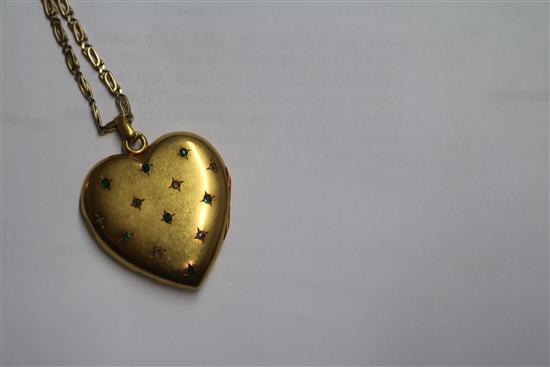 A Victorian yellow metal and gem set heart shaped pendant locket, on a later 9ct gold chain, locket 31mm.